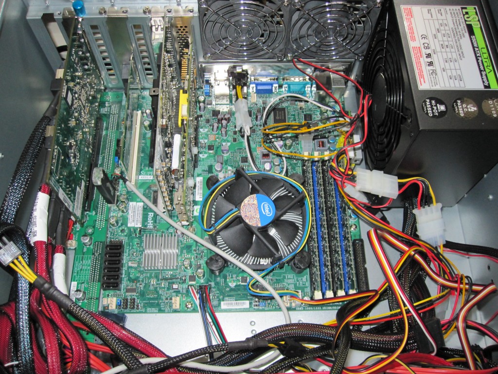 Supermicro X8SIL-F next to the HP-SAS Expander and PCMIG setup with both power supplies