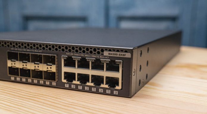 Netgear M4300-8X8F Review One Switch Two Flavors of 10GbE Netgear M4300 8X8F Cover