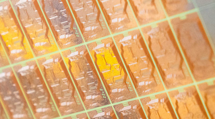 Next-Gen Intel Packaging with Glass Substrates Transition Outlined An Intel Engineer Holds A Test Glass Core Substrate Panel At Int
