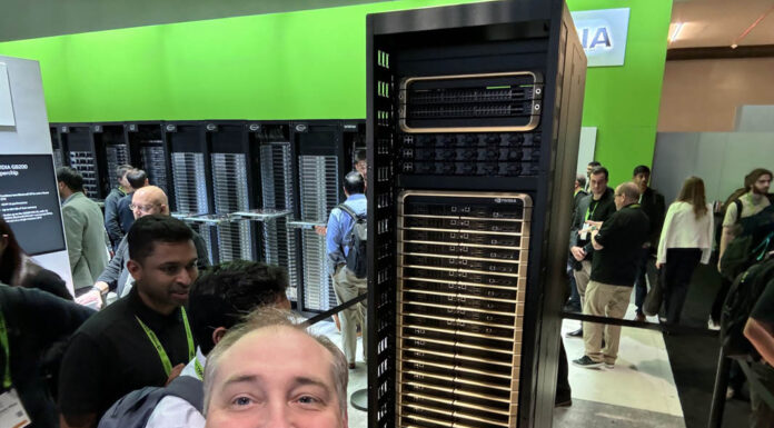 This is the NVIDIA DGX GB200 NVL72 Patrick With NVIDIA DGX GB200 NVL72 At GTC 2024