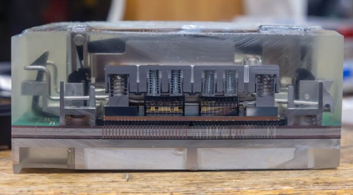 The New IBM z17 Telum II Processor Module Cut Open Down to Silicon IBM Z17 Telum II Module Cutaway Pistons And SMP