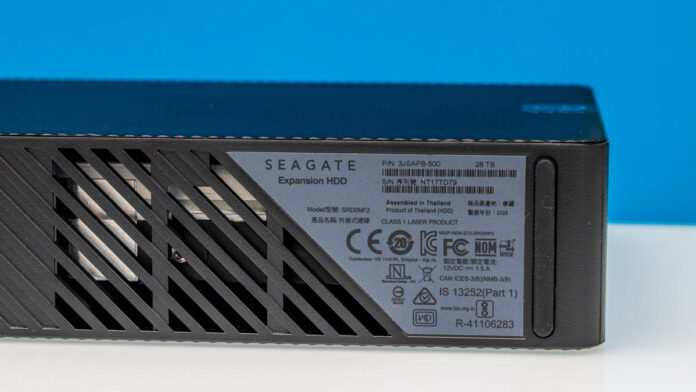Exernal Drive Label Seagate Expansion 28TB External Hard Drive and the HAMR HDD Within Mini ...
