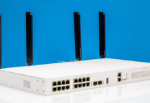 MikroTik CRS418-8P-8G-2S+5axQ2axQ-RM Review The All-in-One PoE Switch Router with WiFi 6 MikroTik CRS418 8P 8G 2S 5axQ2axQ RM Front Angled 2