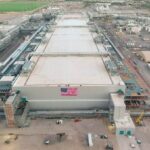 An American flag hangs from Intel s Fab 62 in Arizona where construction continues on the company s sixth hig