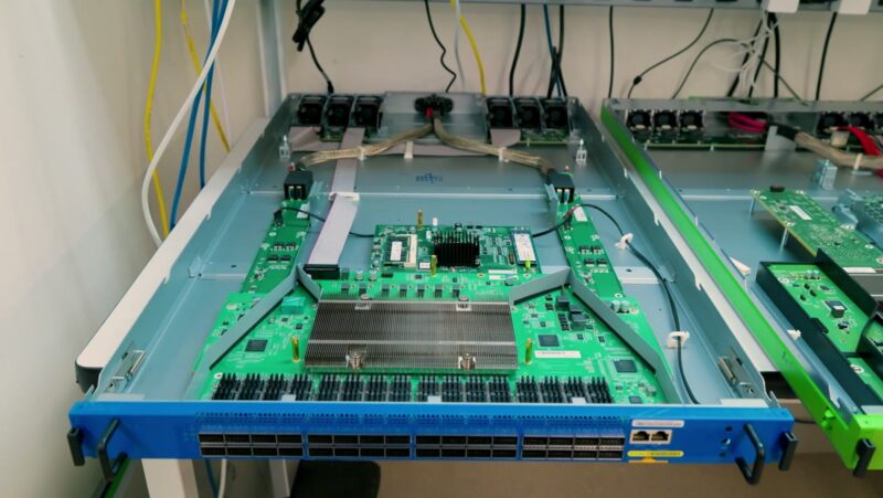 STH AWS Networking Lab Tour - Blue 3.2 Tbps AWS switch with cover removed