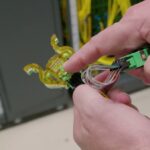 STH AWS Networking Lab Tour – Ganged MMC connector with 64 fibers and Firefly loopback cap