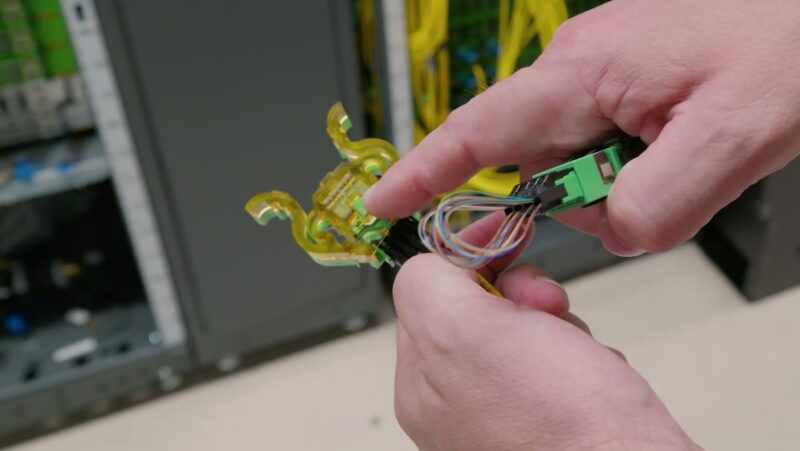 STH AWS Networking Lab Tour - Ganged MMC connector with 64 fibers and Firefly loopback cap STH AWS Networking Lab Tour - Ganged MMC connector with 64 fibers and Firefly loopback cap